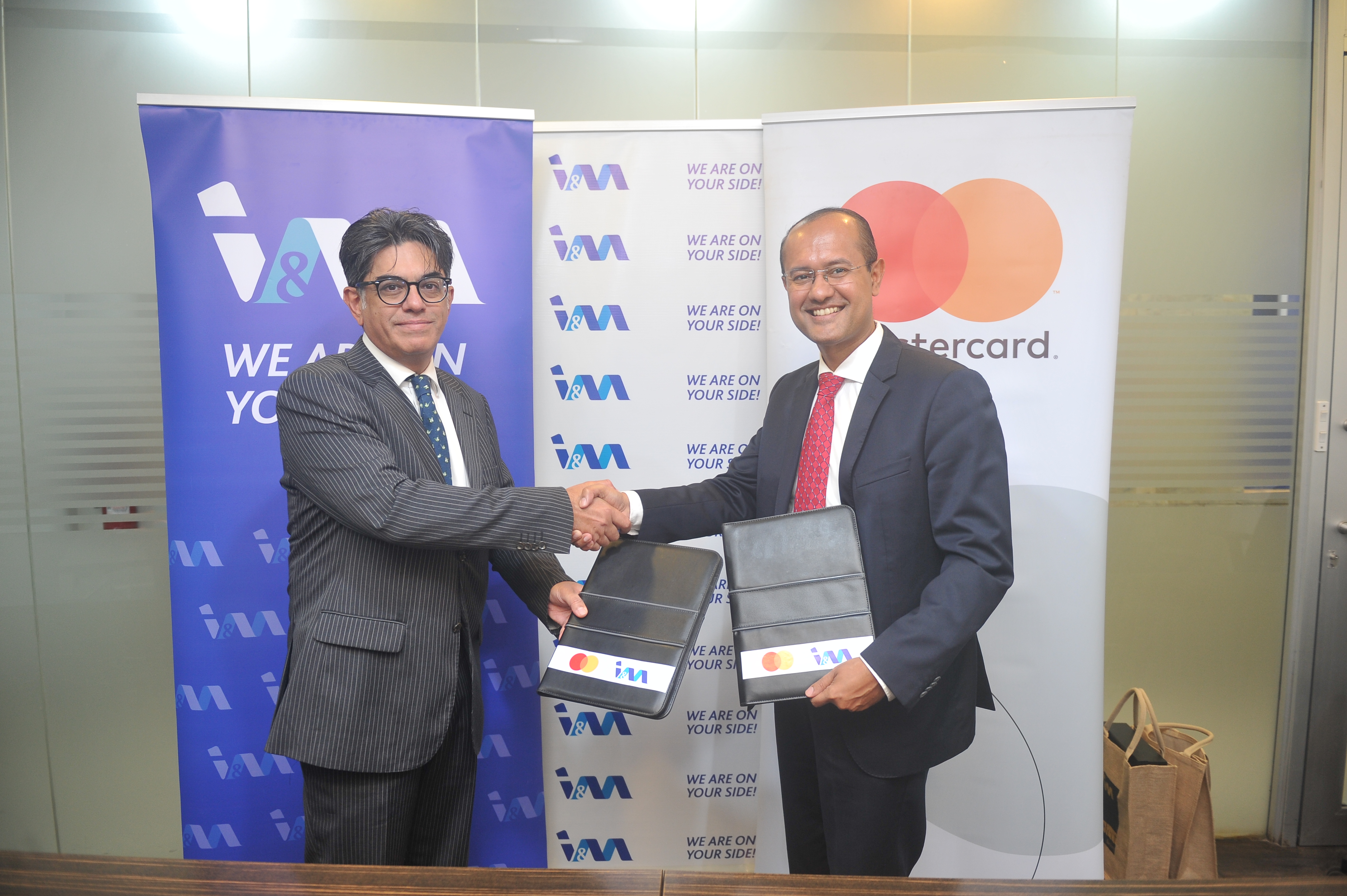 Photo caption: Zahid Mustafa, Chief Executive Officer for I&M Bank Tanzania (L) and Shehryar Ali, Country Manager for East Africa at Mastercard (R) sign agreement that will enable I&M Bank customers to make transactions using Mastercard Premium World Debit Card and Multicurrency Prepaid Cards