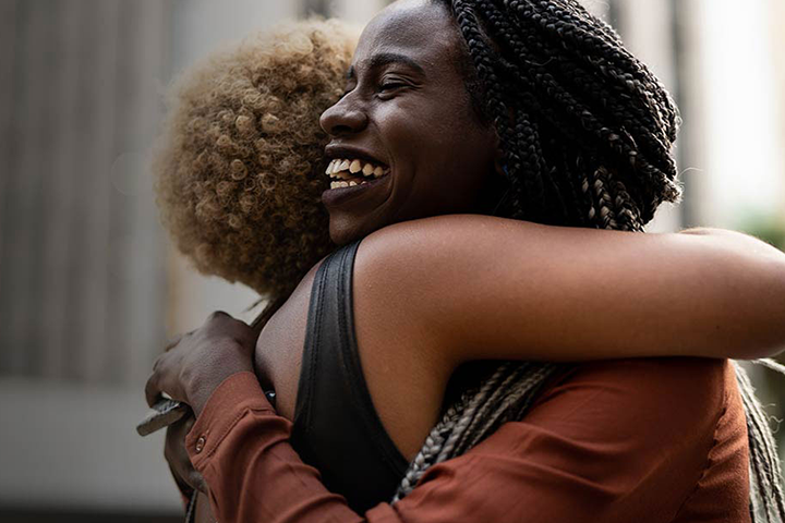 Two women hugging.