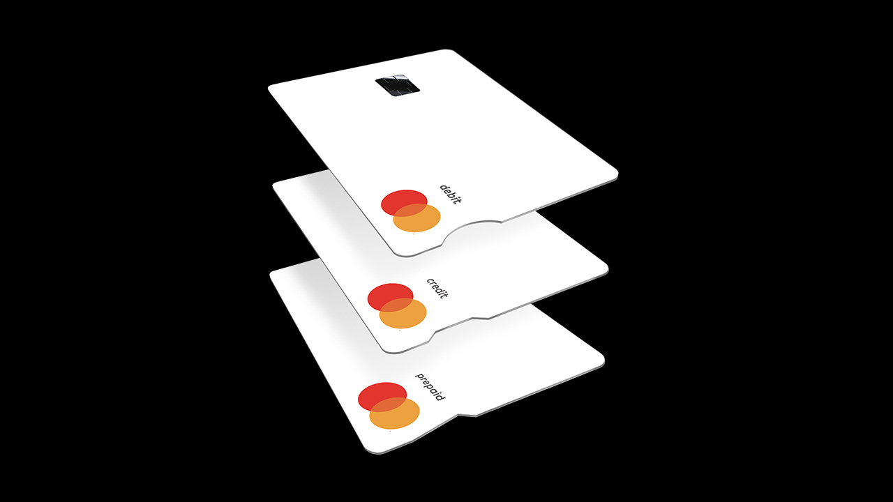 Imagem: Cartão de débito New Touch Card com entalhe redondo, cartão de crédito com entalhe amplo e reto, e cartão pré-pago com entalhe triangular.
