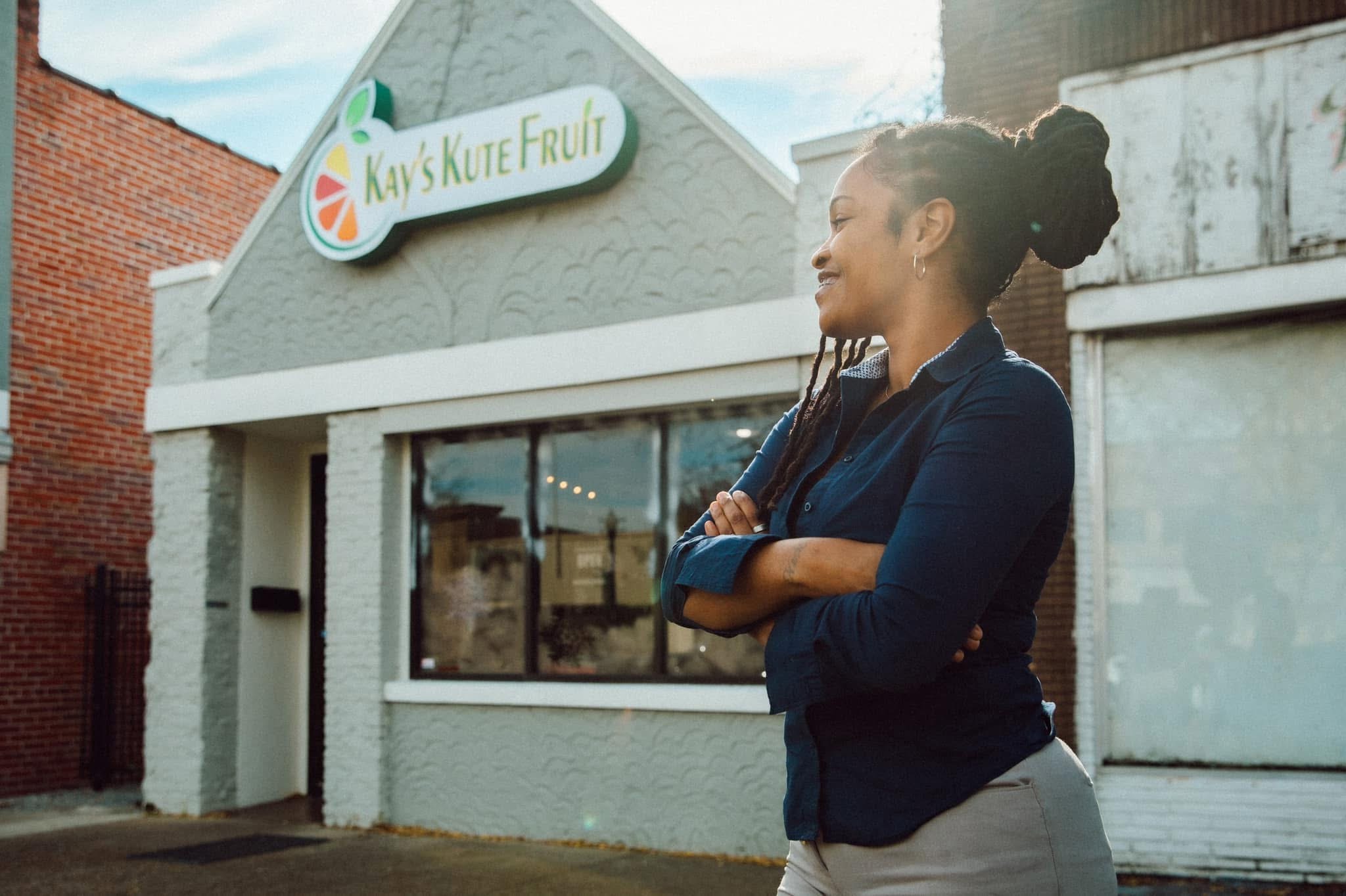Kenesha Lewis stands outside Kay's Kute Fruit.